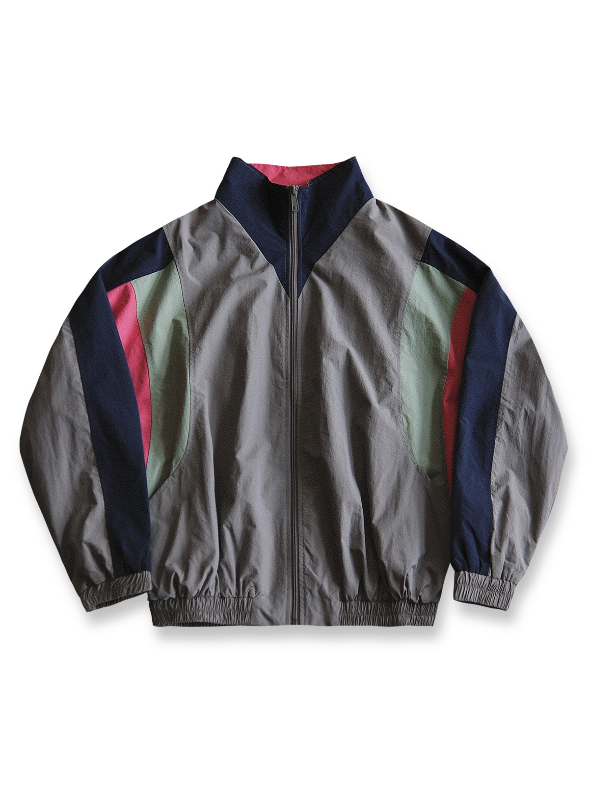 製品画像: ヴィンテージパッチワークコーチジャケットの正面画像、80年代風のカラーブロックデザイン
詳細画像: 防水・防風ナイロン素材とパッチワークディテールが特徴のヴィンテージコーチジャケット