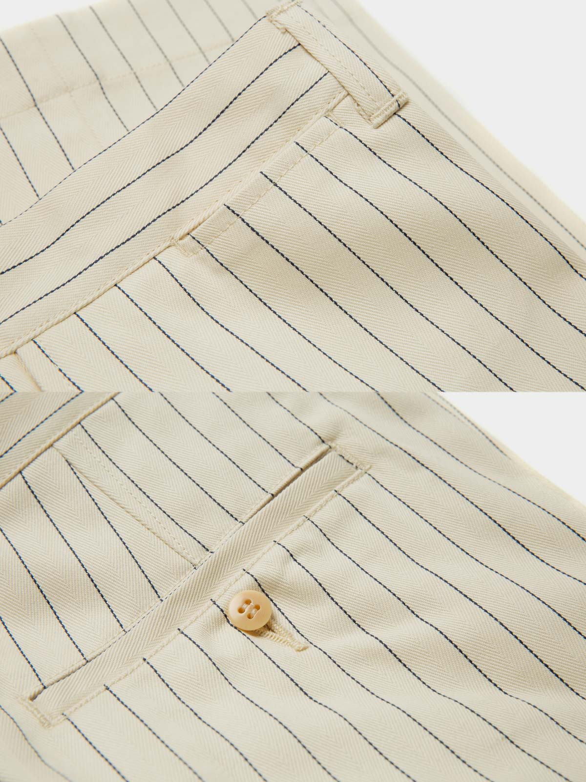 パンツのストライプディテールとカスタムボタン