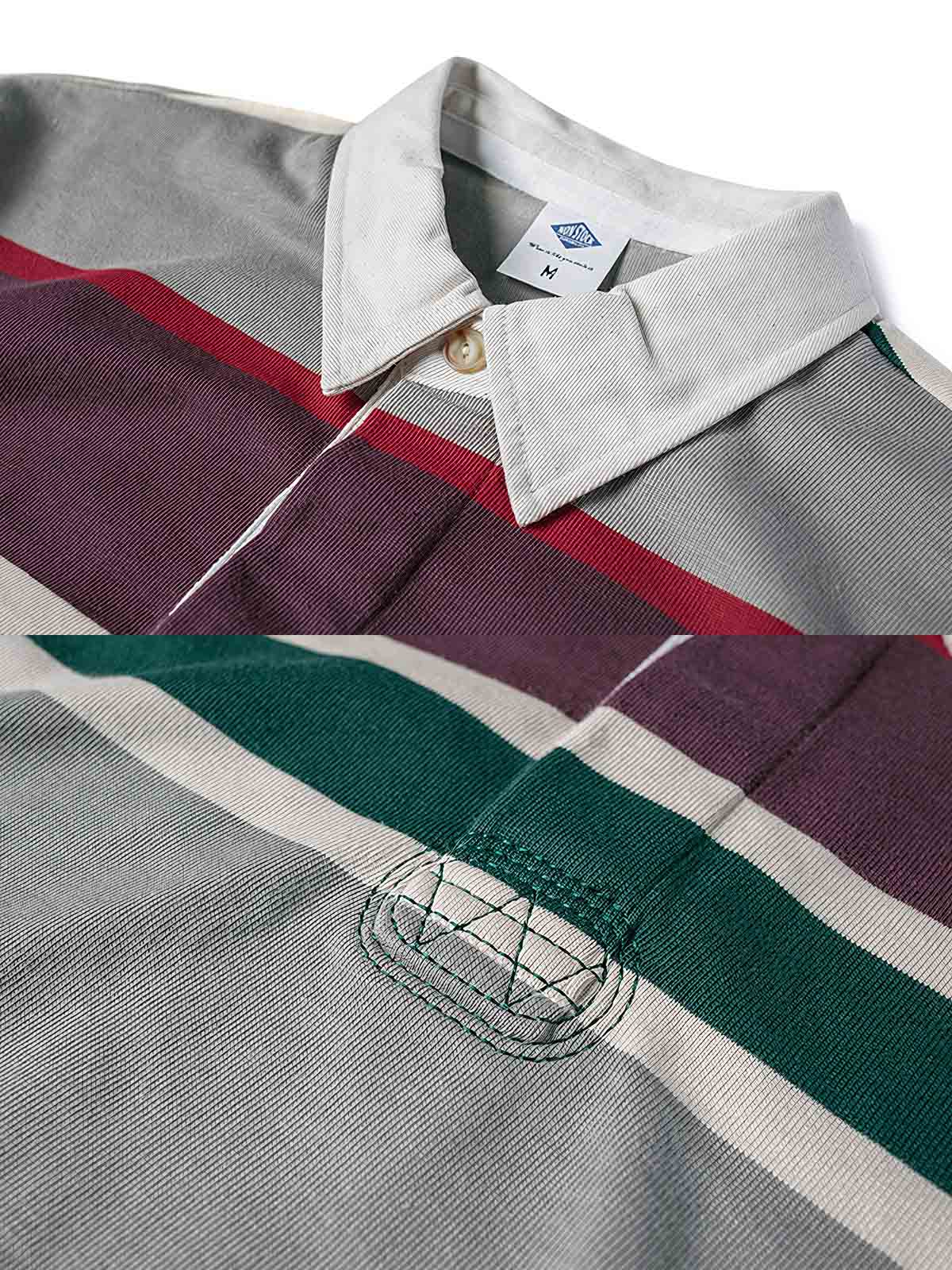 製品画像
グレーとバーガンディを基調としたブロックストライプデザインのラグビーシャツ。太いストライプと細いラインの組み合わせが80-90年代のアメカジカレッジスタイルを忠実に再現したクラシックな一着
詳細画像
ピュアコットン素材の襟元とグレーとバーガンディのブロックストライプ切り替え部分のディテール。丁寧な裁縫技術が際立つ仕上がりで、セロスパン技術によるヘビーウェイト生地の質感が魅力