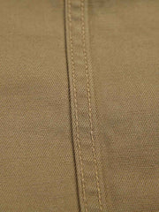 製品画像
リバーシブル仕様のトラ刺繍ワークシャツ全体デザイン。片面には胸元に精緻なトラ刺繍、もう片面には竹林に佇むトラのデザインが施された、オリエンタルデザインとミリタリースタイルが融合したシャツ
詳細画像
胸元に施されたトラ刺繍と銅製ボタンのディテール特写。蘇繍(ソシュウ)の伝統技法による繊細なステッチと、クラシックなミリタリーグリーンキャンバス素材の質感が特徴