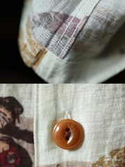 ハワイアンシャツの細部を示すクローズアップ、浮世絵プリントとレトロ樹脂ボタンのディテール。