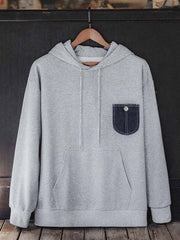 製品画像:
「デニムポケット付き パッチワーク パーカーの全体正面展示図。280g/m²のコットン感ストレッチニット素材を使用し、霜降り模様の生地とヴィンテージ感漂うデニムポケットデザインが特徴。快適さと耐久性を兼ね備えた春秋に最適なアイテム。」
詳細画像:
「霜降り模様のコットン感ストレッチニット生地と、白いステッチと刻印入り銅製ボタンをあしらったデニムポケットのディテールクローズアップ。パッチワークデザインがヴィンテージ感と立体感を強調。」