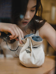 両面使えるバケットハットとポータブル小銭入れ