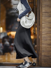 モデル画像:モデルが着用したピンクフレアスカートのコーディネート