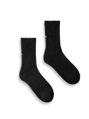 製品画像: ヴィンテージ風ヘビーゲージ刺繍ニットクルーソックスの全体展示。高品質なデザインと快適な履き心地。
詳細画像: かかと部分に施された「What's Up」刺繍のディテール展示。