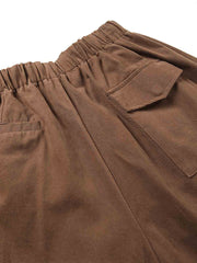 製品画像: ドローストリング付きベーシックワイドパンツのフロントビュー、シンプルなデザイン。
詳細画像: ドローストリングのデザインディテール、100%コットン素材の質感が確認できる。