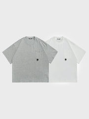 製品画像: ポケット装飾付きラウンドネックシャツの正面画像