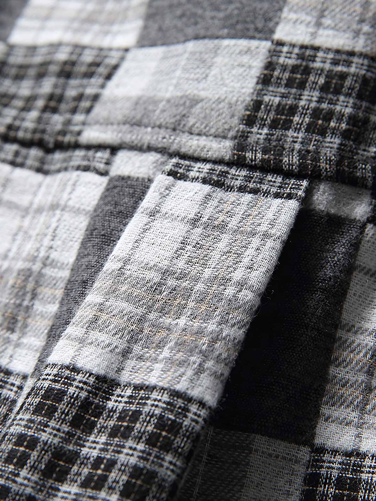 製品画像: ブラック&ホワイトのチェック柄カジュアルシャツの正面展示
詳細画像: シャツの襟とチェック柄のディテールクローズアップ