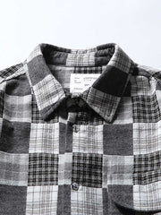 製品画像: ブラック&ホワイトのチェック柄カジュアルシャツの正面展示
詳細画像: シャツの襟とチェック柄のディテールクローズアップ