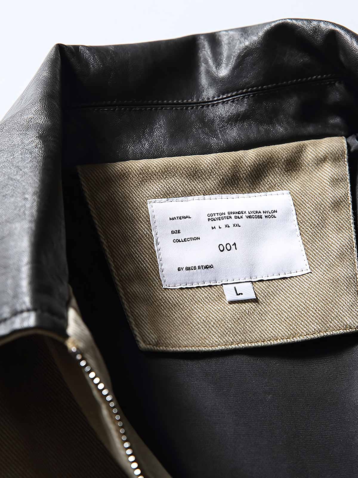 製品画像: レザーカラーワークジャケットの正面展示
詳細画像: ジャケットのレザー襟とジップポケットのディテール展示