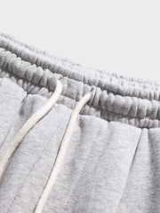 裾絞り 刺繍入り スウェットパンツ