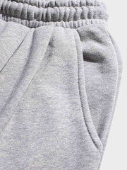 裾絞り 刺繍入り スウェットパンツ