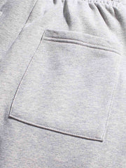 裾絞り 刺繍入り スウェットパンツ