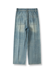 詳細画像: デニムパンツの猫ひげテクスチャデザインとヴィンテージウォッシュ加工のクローズアップ