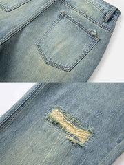 詳細画像: ジーンズの猫ひげ模様と破れのディテール特写