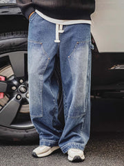 詳細画像:
ダブルニーのパッチ、アンティークゴールドのYKKジッパー、ヴィンテージ感を強調したウォッシュド加工とツイル生地のディテールアップ
モデル画像:
モデルが着用したアメリカンヴィンテージ風ダブルニー ワークデニムパンツ、ルーズフィットのストリートスタイルコーディネート