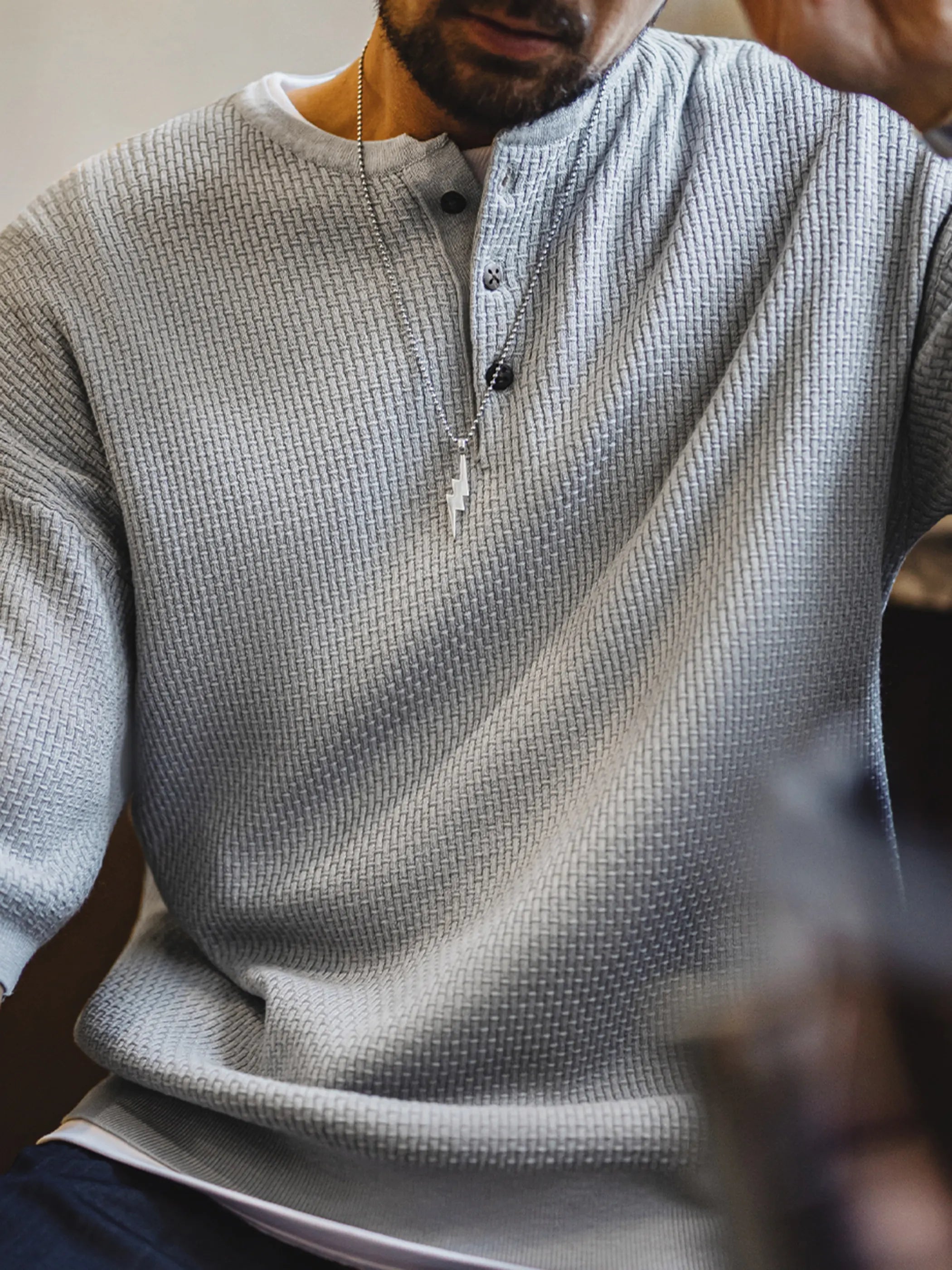 フロント全体の竹節編みヘンリーショートスリーブニット