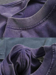 ドロップショルダーヘビーウェイトTシャツの細部と高品質ダブルヤーンピュアコットン素材のクローズアップ。通気性と吸湿性に優れ、独特の加工技術による色落ちのしにくいテクスチャを特徴としています