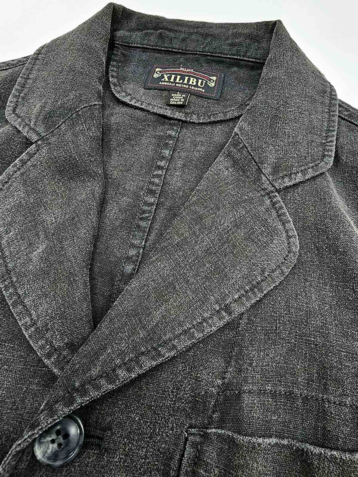 製品画像:バティック染めヴィンテージリネンジャケットの正面画像
詳細画像:袖口に施されたヴィンテージ風ボタンと色落ち加工のディテール