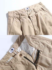 詳細画像: ヘリンボーンのディテールとパンツの裾デザインの特写