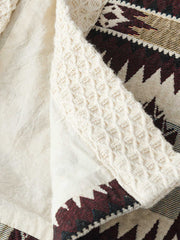 シェニール生地とインディアン柄ジャカード、古銅色ボタンのディテールアップ