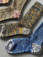 製品画像: カラーミックスヴィンテージロングソックスの5足セット展示、カジュアルで暖かいデザインが特徴。
詳細画像: カラフルなミックス糸で編まれた太糸ソックスのディテール画像、ヴィンテージ感を強調。