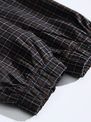 格子柄のフード付きジャケット、配色切り替え部分あり