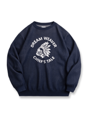 フレンチブルドッグとチーフヘッドドレス柄を編み込んだオーバーサイズニットセーター。