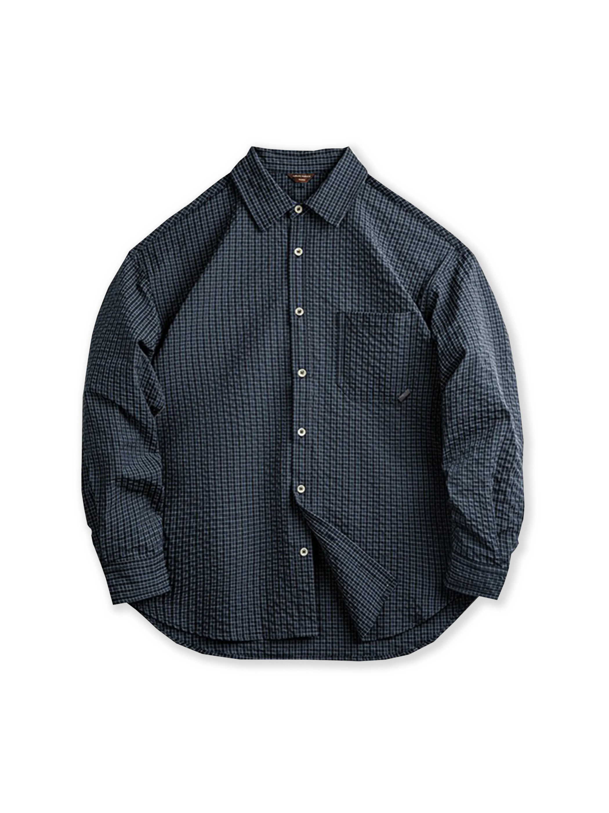 シアサッカー生地と肘あてパッチが特徴の、耐久性とヴィンテージ感を兼ね備えたアメリカンヴィンテージチェックシャツ。