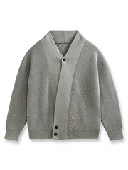 アシンメトリーデザインのルーズフィットニット。ポリエステルとコットン混紡で耐久性と快適さを両立。