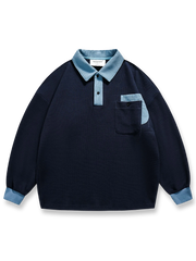 バイカラーオープンカラープルオーバースウェットの全体正面画像、バイカラーパッチワークと胸ポケットのディテール。