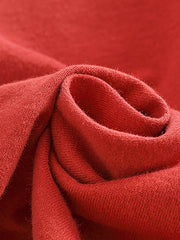 製品画像: BROOKLYNヴィンテージプリント長袖Tシャツの全体展示 詳細画像: Tシャツの裾にあるパッチワークデザインのディテール