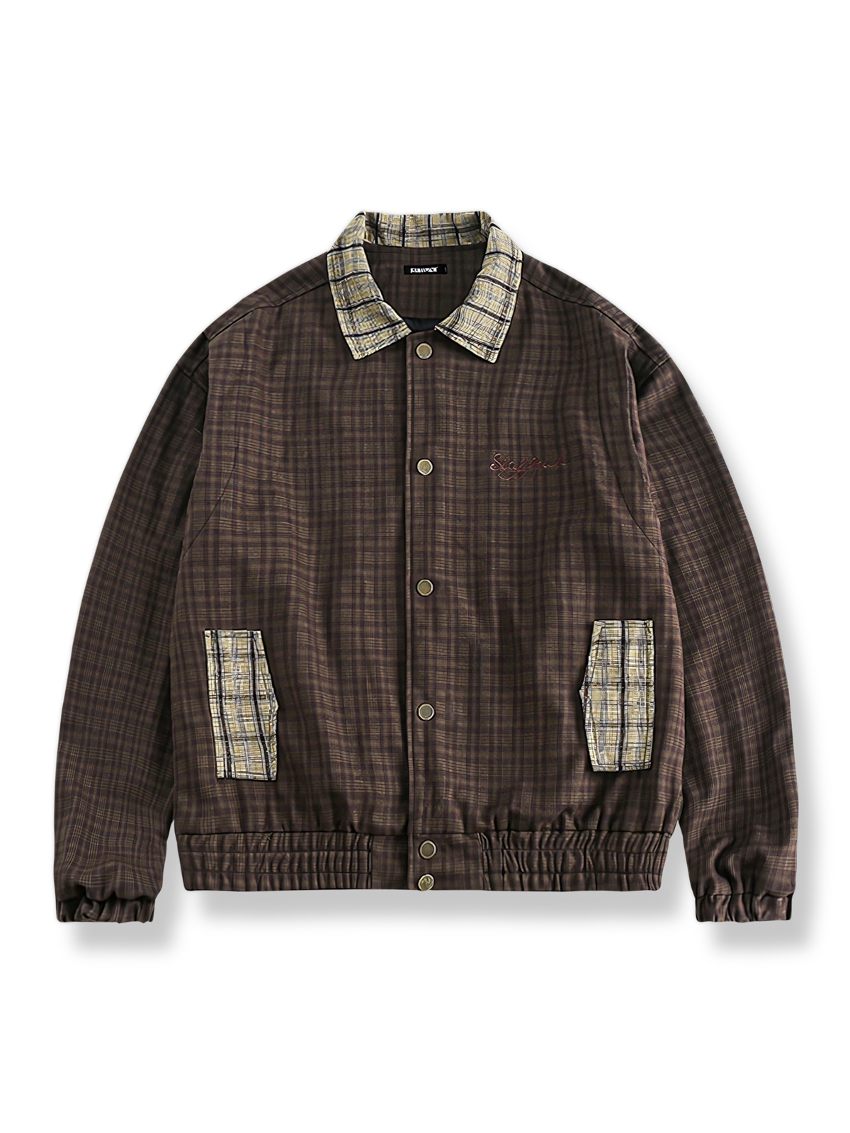 茶色地に黄色の格子柄襟と袖口を配したコントラストカラージャケット。