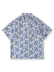 花柄と蝶の水彩プリントが映えるリネン製キューバカラーシャツ。