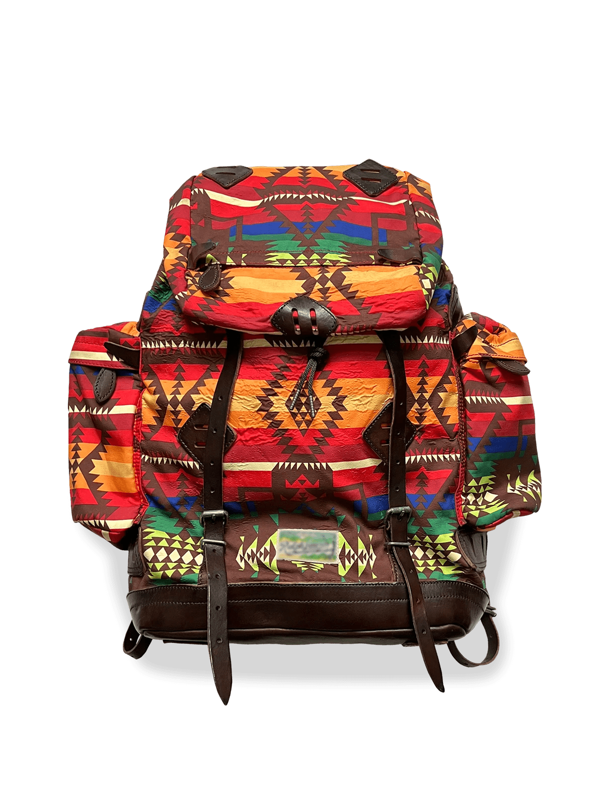 クラシックなインディアン柄をあしらったナイロンとキャンバス素材のバックパック。ダークブラウン牛革ストラップと補強、複数ポケットを備えたデザイン。