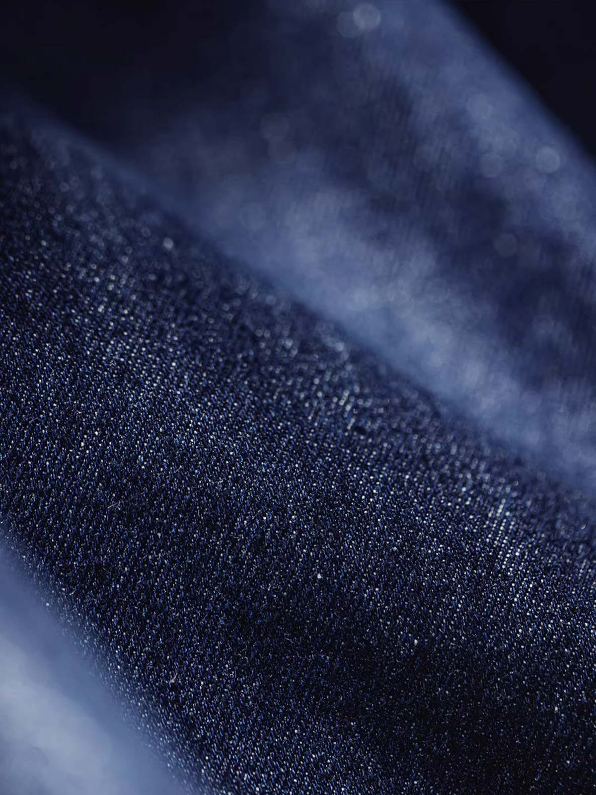 製品画像: M51デニムフィッシュテール パーカ(フード付き)の全体像を正面から撮影した画像
詳細画像: 青銅色のジッパーとフィッシュテールデザインを強調したディテール画像