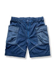 メッシュナイロン素材のM65ワークショーツ。通気性と耐久性を両立し、ダブルレイヤーポケットと脚部ストラップで機能性を高めた五分丈ショーツ。