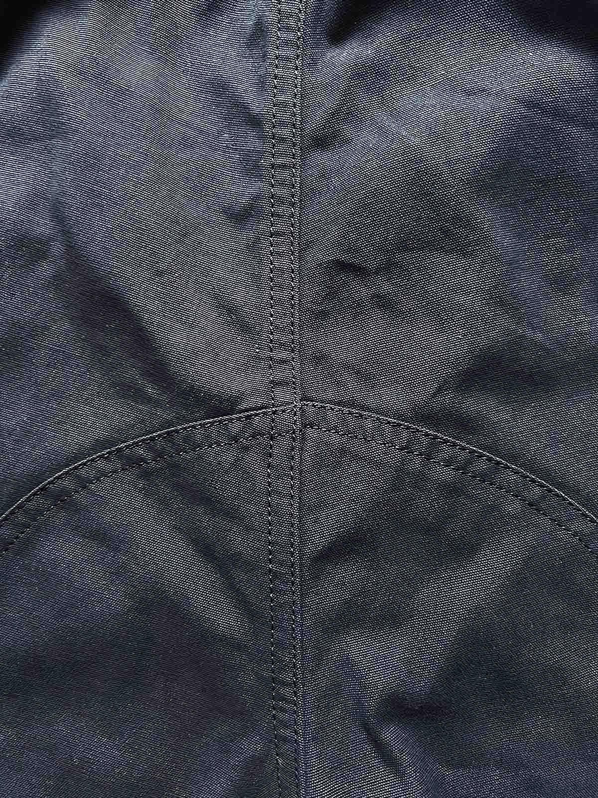 製品画像: M65アウトドアメッシュナイロンワークショーツの正面全体画像。五分丈デザインで、耐久性と通気性に優れた軽量メッシュナイロン素材を使用。春夏のサイクリングやアウトドア活動に最適なワークショーツ。
詳細画像: M65アウトドアメッシュナイロンワークショーツのポケットと脚部のストラップディテール画像。収納力のあるダブルレイヤーポケットと、快適さを高めるストラップデザイン。