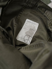 製品画像: ヴィンテージアメリカンウォッシュド加工パッチワークOG107ミリタリーパンツの正面図
詳細画像: パッチワークとペイントディテールの展示