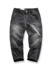 ペイント加工とダメージ加工が施されたヴィンテージ風ワークパンツ、耐久性のあるワークポケット付き