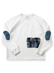 ペイズリー柄パッチワークと複数ポケットを配した100%コットン製ルーズフィットスウェットシャツ。