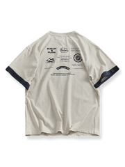 パッチワークカフスと両面プリントが特徴のコットン半袖Tシャツ