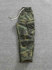 ワークパンツのサイドポケットとウエストゴム、ドローストリングデザインのディテール図