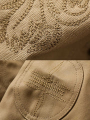 製品画像: オイルワックスジュファブリックのアメリカンビンテージライダースジャケット平置き画像 - 防風・保温デザイン
詳細画像: ヴィンテージ刺繍とコーデュロイ襟のディテール - レイヤー感とヴィンテージスタイル