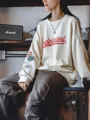 カレッジ風ラグランスリーブスウェットシャツ