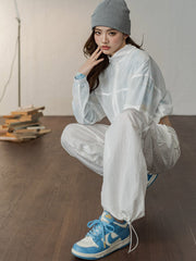 詳細画像: パラシュートパンツの二重防透とドレープデザインのディテール