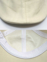 ベレー帽の精緻なステッチと生地の質感がクローズアップされており、その細部の美しさが強調されています。