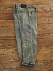 製品画像:レトロなルーズフィットのウォッシュドサンドカラーデニムパンツ
詳細画像:クラシックなサンドカラーデニムのディテール展示