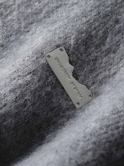 製品画像: ウール混紡フード付きニットカーディガンジャケットの正面画像
詳細画像: ニットのテクスチャーとジッパーのディテール