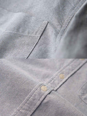 製品画像: エスニック刺繍スリーブのオックスフォードシャツの正面展示 詳細画像: 袖に施されたエスニック刺繍のディテール